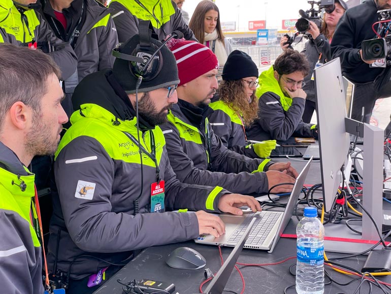 Team Polimove in the pits at their control table.